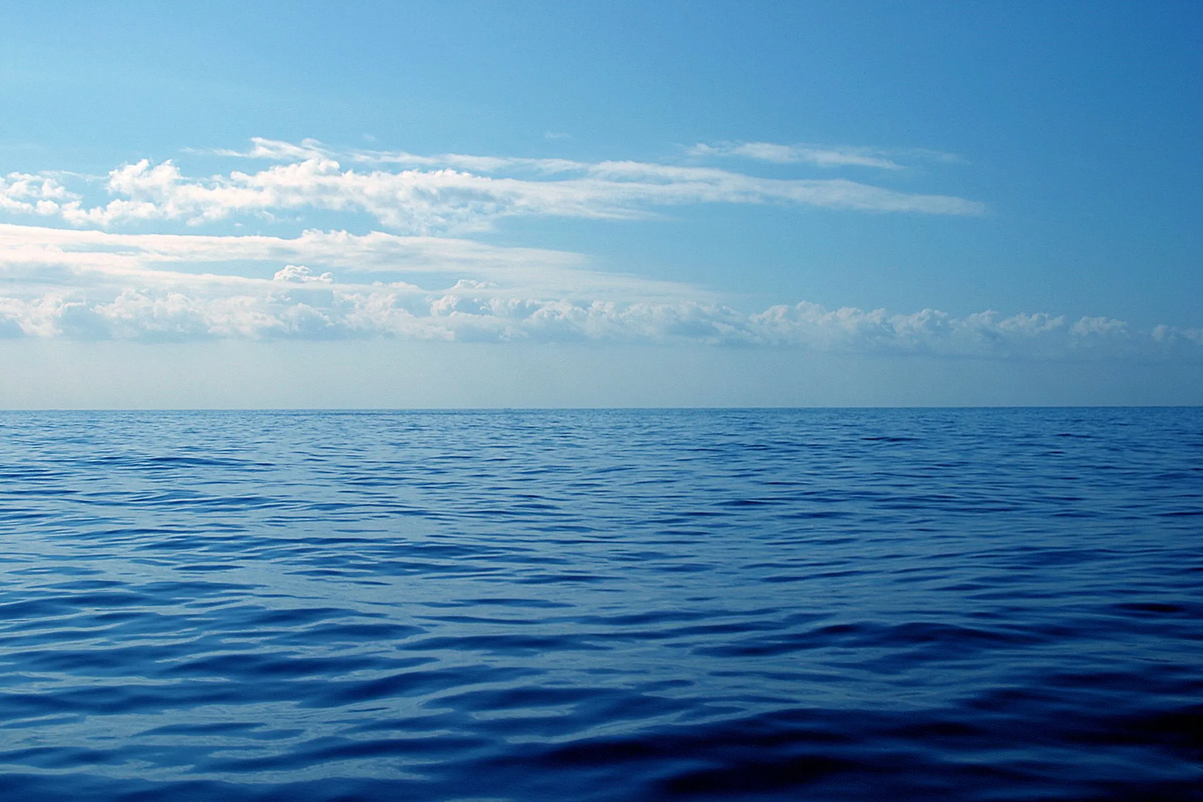 A calm deep-blue Mediterranean stretching to a straight horizon